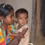 Chumudi Madkami of Palkonda village in Malkangiri with her malnourished son Aditya. (Photo by Basudev Mahapatra)