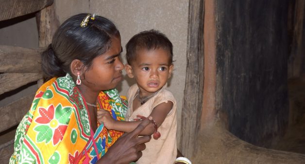 Chumudi Madkami of Palkonda village in Malkangiri with her malnourished son Aditya. (Photo by Basudev Mahapatra)