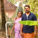 Komalam Ramachandran of Naduvilkara in Thrissur district and her son in front of the well in their house. (Photo by S. Gopikrishna Warrier)