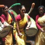 Women have started playing the dhak, a big drum traditionally played only by men.