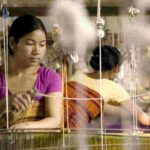 A Bodo woman working at a traditional handloom in Rowmari village. (Photo by Action for Northeast Trust)