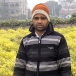 Rakesh Kumar of Chakwara village in front of his cauliflower seed farm. (Photo by Mohd Imran Khan)