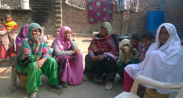 A group of village women in Nuh discusses the merits of digitizing the targeted public distribution system. (Photo by Debika Goswami)