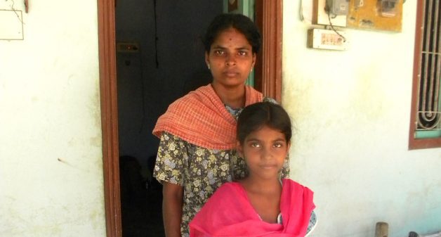 Shanti Shanmugam of Vadugapatty village says her daughter Nandana is yet to recover fully from the snakebite she received as a child. (Photo by Sharada Balasubramanian)
