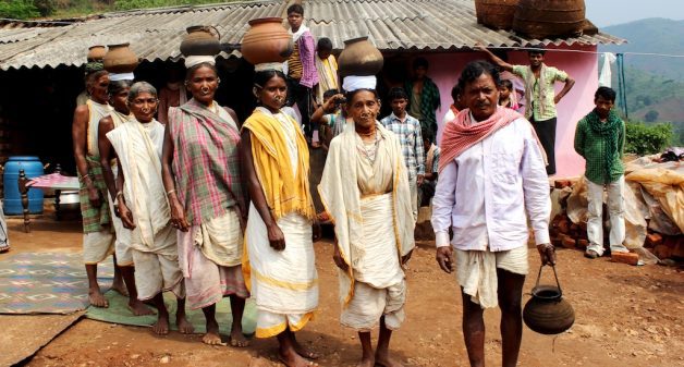 Led by village headman Krusna Kadraka and Dasara Kadraka in an earlier mission to collect lost millet varieties, the women of Kadarguma prepare to walk to their clan families in remote hamlets. (Photo by Manipadma Jena)