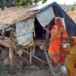 Women who remain on the island after the men migrate take shelter in a stilt house during floods. (Photo by Sayanti Sengupta)