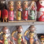 Traditional wooden dolls adorn a shelf in Channapatna. (Photo by Chithra Ajith)