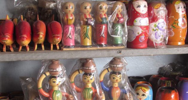 Traditional wooden dolls adorn a shelf in Channapatna. (Photo by Chithra Ajith)