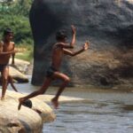 Will children growing up in rural India be able to fly like a kite or will they forever live like a grasshopper? (Photo by Thaths)
