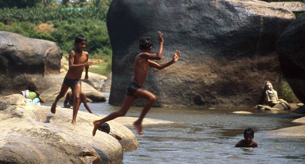 Will children growing up in rural India be able to fly like a kite or will they forever live like a grasshopper? (Photo by Thaths)