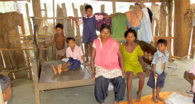 Children and their teacher at a daycare center that has none of the facilities mandated by ICDS. (Photo by Abhijit Mohanty)