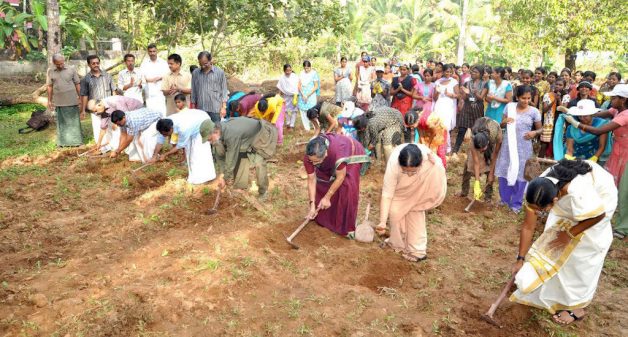 Community members prepare the ground to plant saplings (Photo by Niravu)