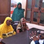 Mohammad Sabir of CISC guides woman villagers, helping them seek government benefits, as a first step towards empowering them (Photo by Tarun Kanti Bose)