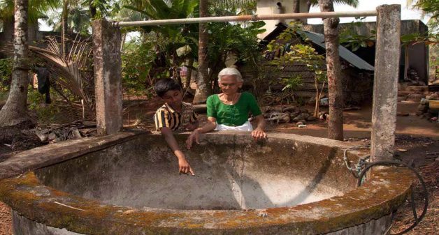 Madhavi of Chakkamkandam village has seen the pristine backwaters turn into a cesspool, contaminating even their open wells (Photo by Arun P.J.)