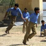 Boys playing tag in a village school (Photo by Jasper Veen)