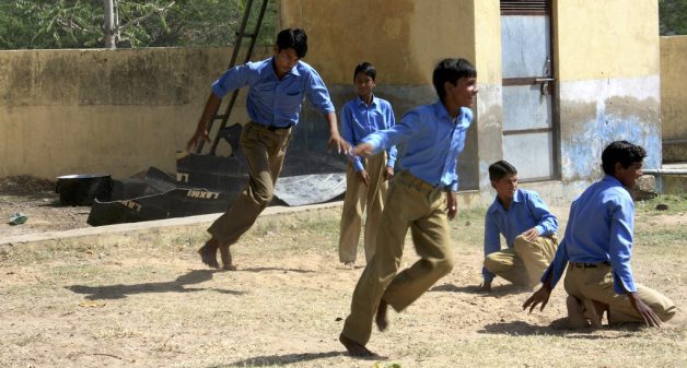 Boys playing tag in a village school (Photo by Jasper Veen)