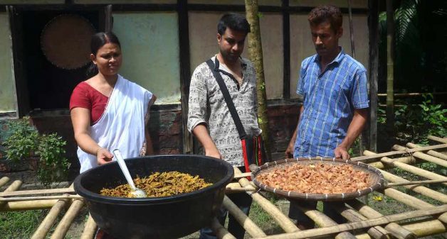 Devanga Saikia in center, guiding Utpola Bora and her husband Binanda Saikia in making pickles in their residence in Nagaon (Photo by Abdul Gani)