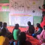A poshan sakhi explains the importance of women, especially expectant and lactating mothers, eating nutritious food (Photo by Rakhi Ghosh)