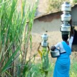 Carrying water is a constant chore for women in rural areas (Photo by Daniel Bachhuber)