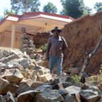 Landslides that resulted after the August 2018 deluge have left steep inclines near coffee grower Shanteyenda’s house, making restoration difficult (Photo by Amoolya Rajappa)