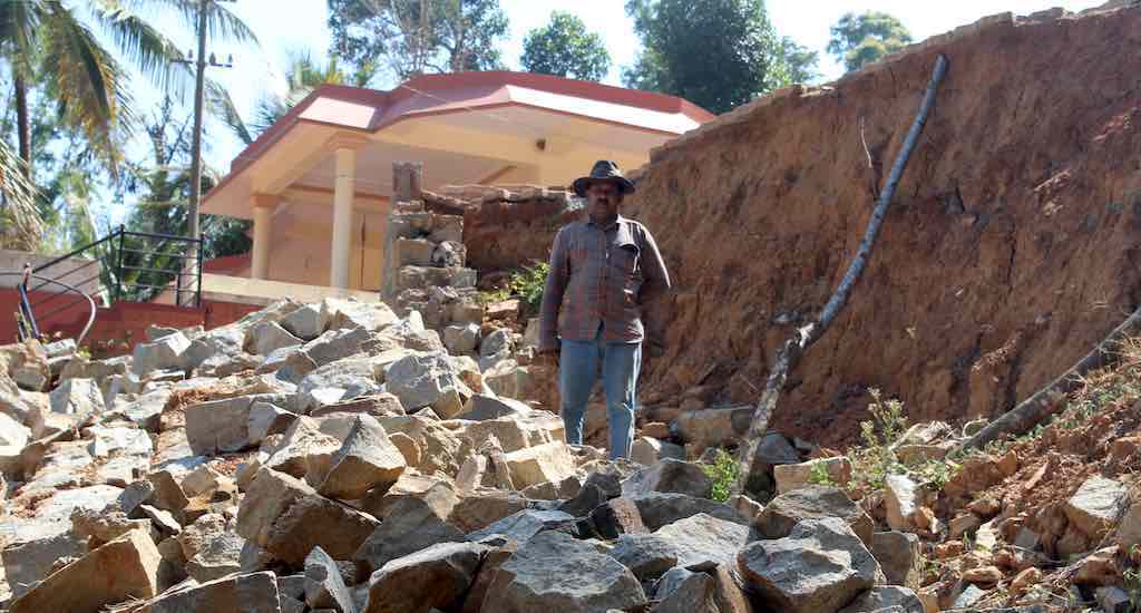 Landslides that resulted after the August 2018 deluge have left steep inclines near coffee grower Shanteyenda’s house, making restoration difficult (Photo by Amoolya Rajappa)
