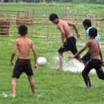 A group of tribal boys playing football (Photo by Flickr)