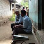 Psychiatrist Manoj Kumar interacting with a villager to diagnose the problem and issue medicine, which will be followed up by healthcare volunteers (Photo by Mental Health Action Trust)