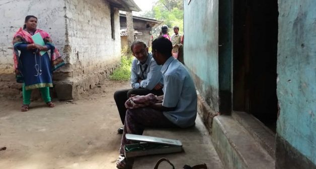 Psychiatrist Manoj Kumar interacting with a villager to diagnose the problem and issue medicine, which will be followed up by healthcare volunteers (Photo by Mental Health Action Trust)