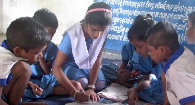 Subhasmita, in addition to convincing parents to send their children to school regularly, helps her classmates and younger children improve their learning (Photo by Rakhi Ghosh)
