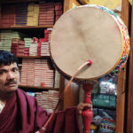 A Tibetan in India with a musical frame drum