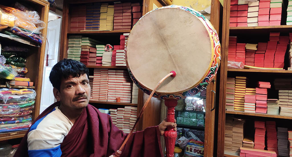 A Tibetan in India with a musical frame drum