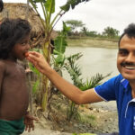The author with children in G-Plot island