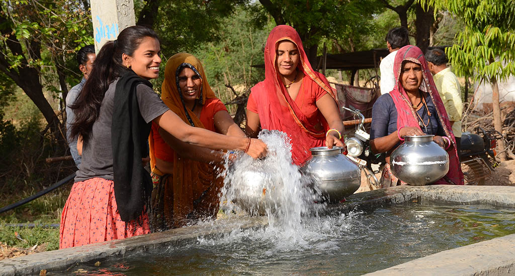 The women are happy that they do not have to walk miles every day to bring water