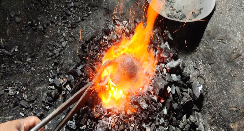 bell metal utensil being made in a fire (Photo by Gurvinder Singh)