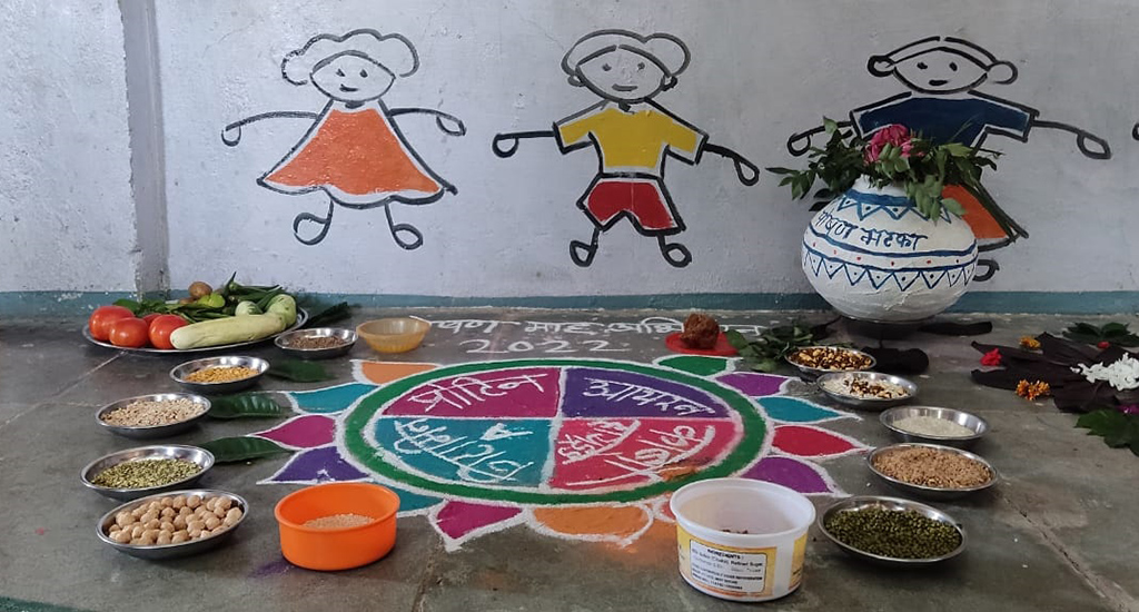 In nutrition month, local foods on display around a colourful rangoli